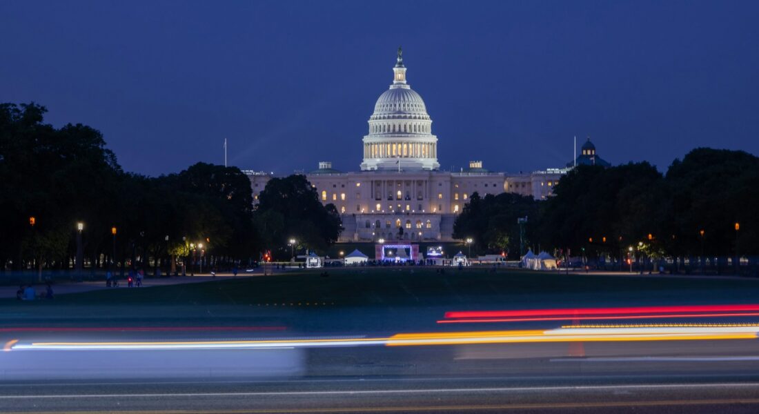 United states capitol building at night with light trails